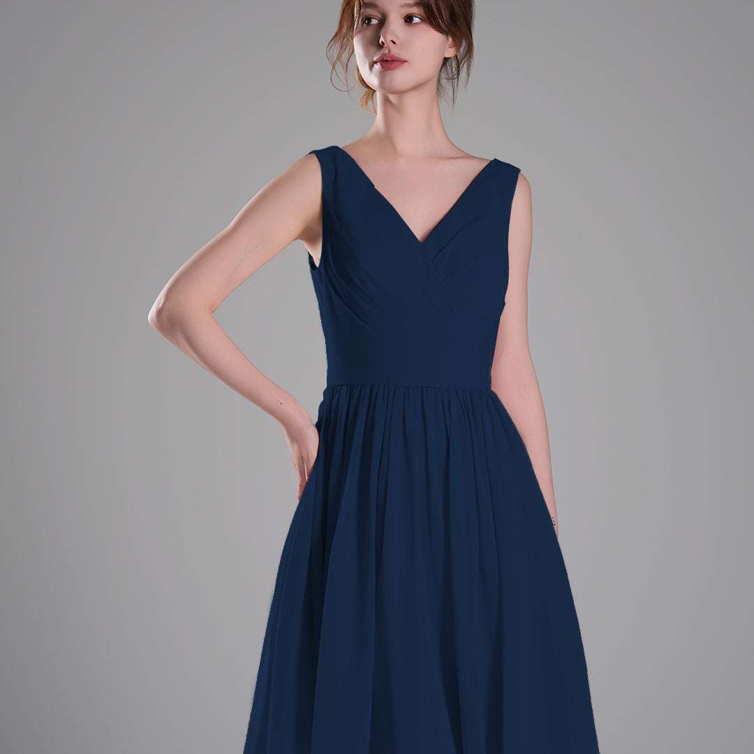 V-Neck Sleeveless Pleated Bodice Flowing Mini Dresses