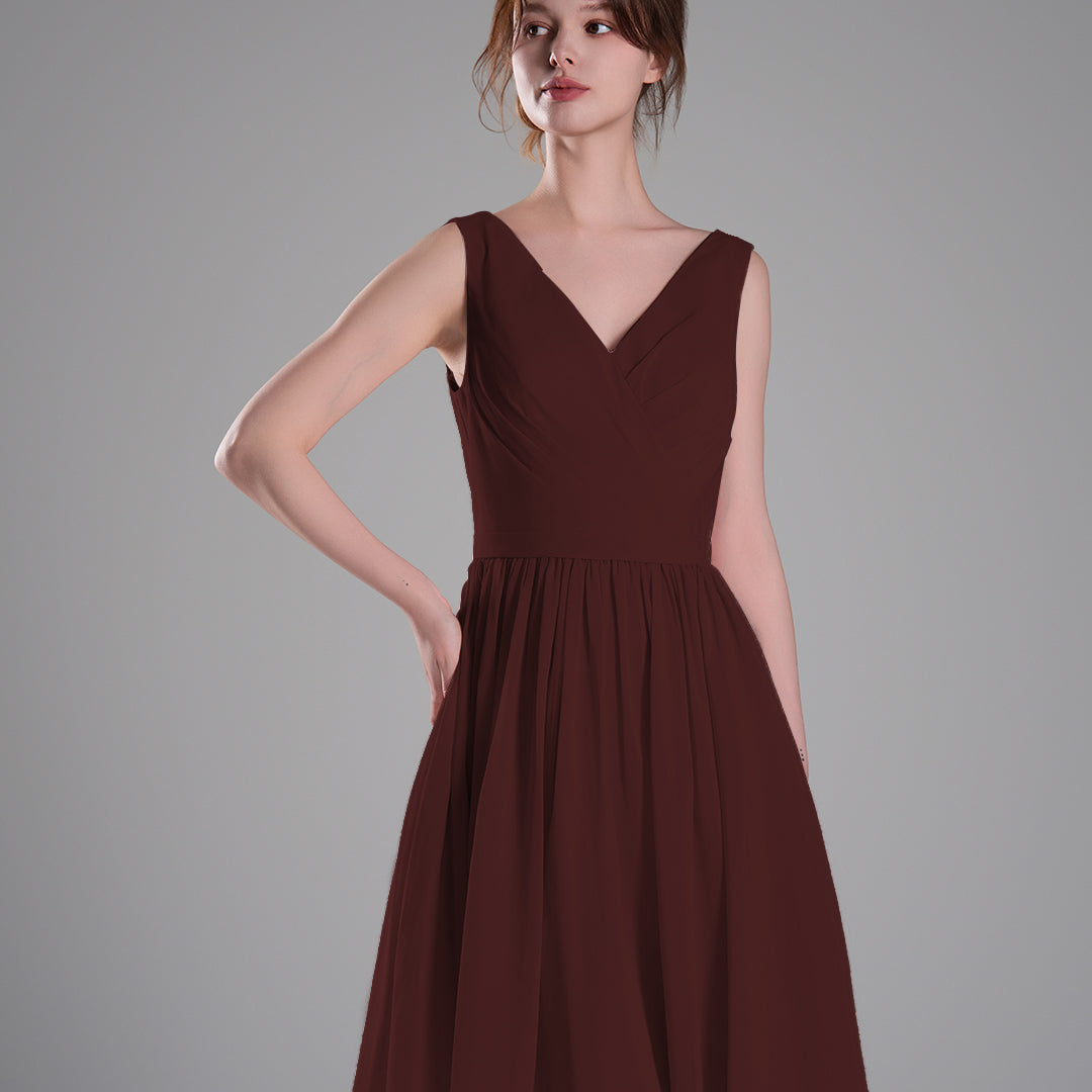 V-Neck Sleeveless Pleated Bodice Flowing Mini Dresses