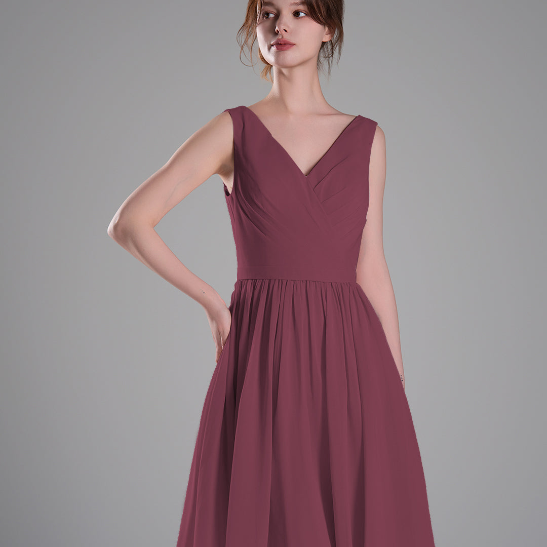 V-Neck Sleeveless Pleated Bodice Flowing Mini Dresses