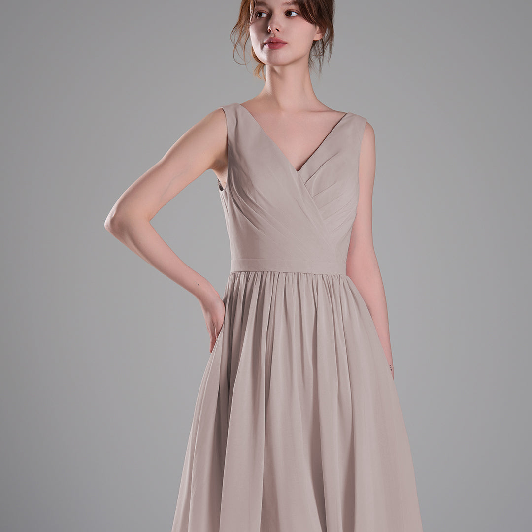 V-Neck Sleeveless Pleated Bodice Flowing Mini Dresses