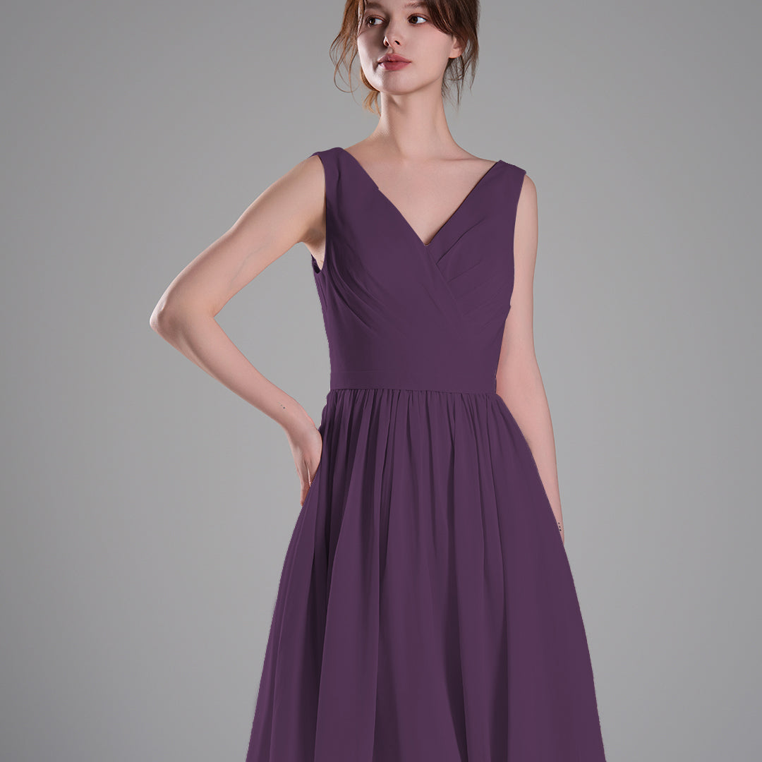 V-Neck Sleeveless Pleated Bodice Flowing Mini Dresses